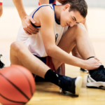 boy suffering from basketball injury
